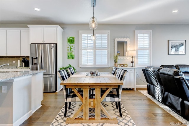 dining room with light hardwood / wood-style floors