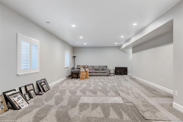 unfurnished room featuring light carpet