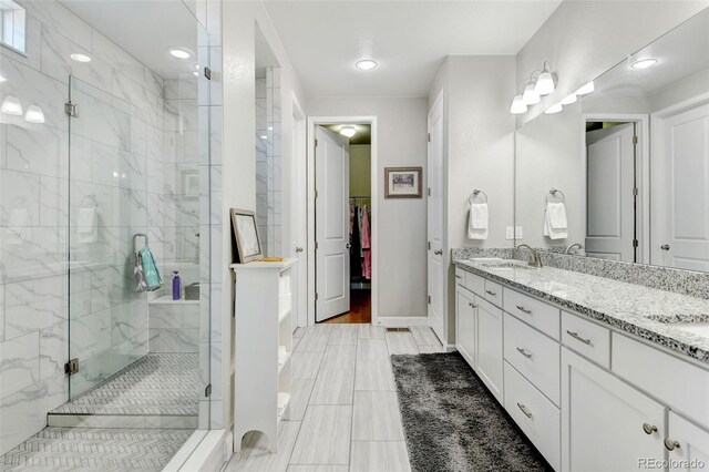 bathroom with vanity, hardwood / wood-style flooring, and walk in shower