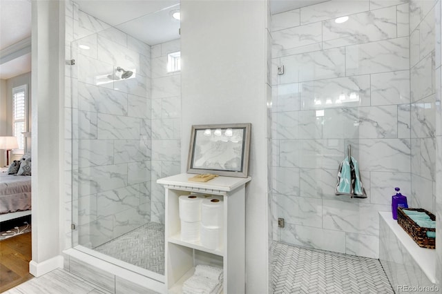 bathroom featuring hardwood / wood-style floors and an enclosed shower