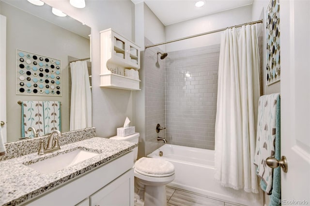 full bathroom featuring vanity, toilet, and shower / tub combo with curtain