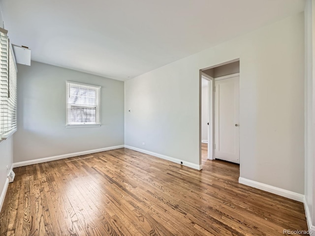 835 Knox Ct, Denver, CO 80204 - empty room with baseboards and hardwood / wood-style floors