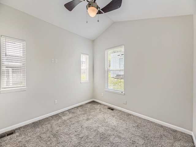 835 Knox Ct, Denver, CO 80204 - empty room with carpet, visible vents, baseboards, ceiling fan, and lofted ceiling