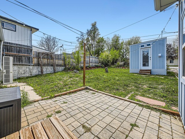 835 Knox Ct, Denver, CO 80204 - view of yard with a fenced backyard, entry steps, and a patio