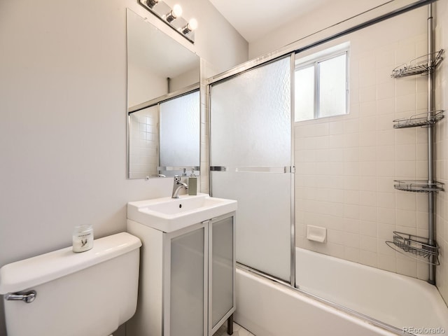 835 Knox Ct, Denver, CO 80204 - full bathroom featuring toilet, vanity, and combined bath / shower with glass door