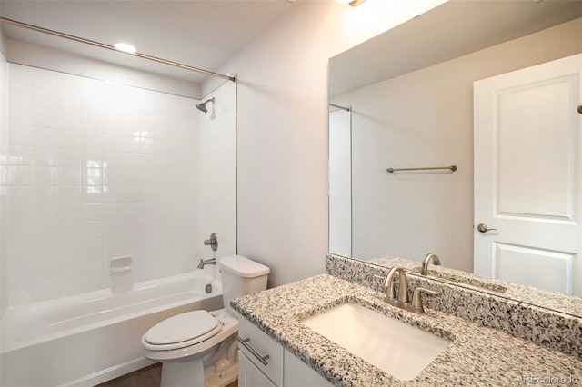 bathroom with toilet, shower / bath combination, and vanity