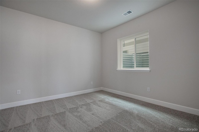 unfurnished room with light colored carpet, visible vents, and baseboards