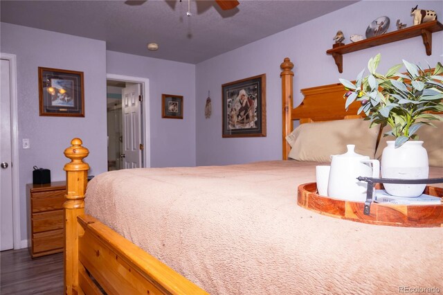 bedroom with ceiling fan and hardwood / wood-style floors