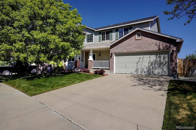 22739 E Prentice Pl, Aurora, CO 80015 - view of front of home featuring a porch, concrete driveway, a garage, and brick siding