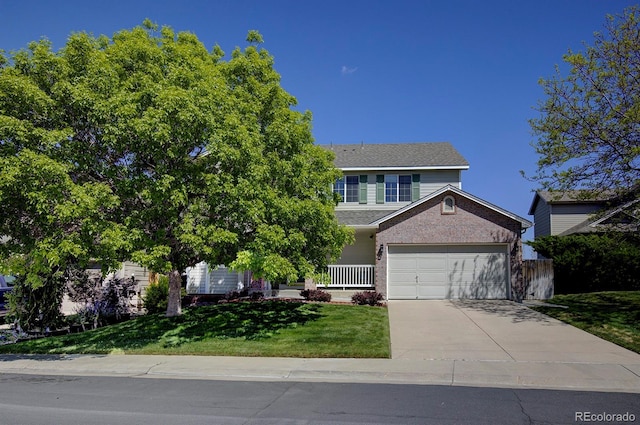 22739 E Prentice Pl, Aurora, CO 80015 - view of front of property featuring concrete driveway, a front yard, brick siding, and a garage