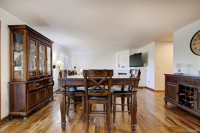 22739 E Prentice Pl, Aurora, CO 80015 - dining room featuring hardwood / wood-style flooring and baseboards