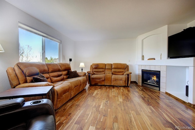 22739 E Prentice Pl, Aurora, CO 80015 - living area featuring light wood-style floors and a fireplace