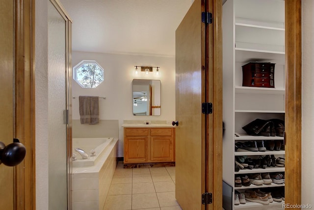 22739 E Prentice Pl, Aurora, CO 80015 - full bathroom featuring a garden tub, vanity, tile patterned flooring, and a stall shower