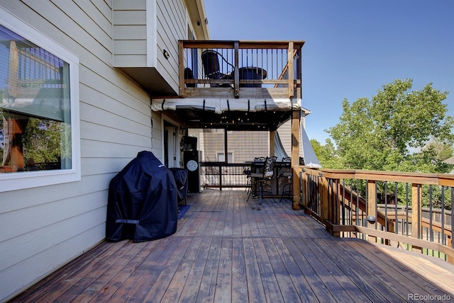 22739 E Prentice Pl, Aurora, CO 80015 - wooden terrace with outdoor dining space
