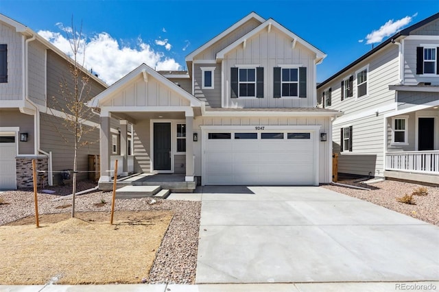 craftsman-style home featuring board and batten siding, driveway, and a garage