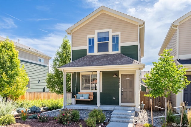 12743 Ulster St, Thornton, CO 80602 - view of front of home featuring a porch and a shingled roof