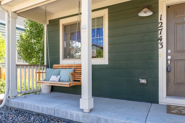 12743 Ulster St, Thornton, CO 80602 - property entrance featuring covered porch