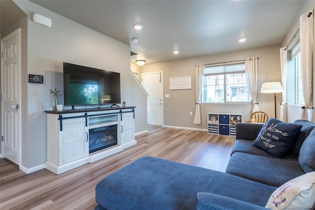 12743 Ulster St, Thornton, CO 80602 - living area featuring light wood-style flooring, plenty of natural light, and recessed lighting