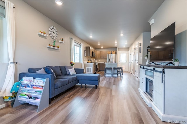 12743 Ulster St, Thornton, CO 80602 - living room featuring light wood-style floors and recessed lighting