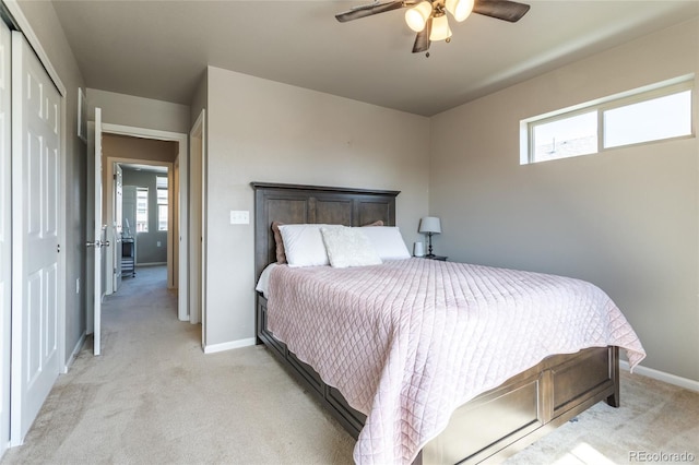 12743 Ulster St, Thornton, CO 80602 - bedroom with light colored carpet, multiple windows, a ceiling fan, and a closet