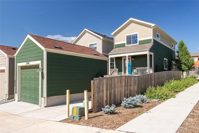 12743 Ulster St, Thornton, CO 80602 - view of front of property featuring a garage, covered porch, a shingled roof, and concrete driveway