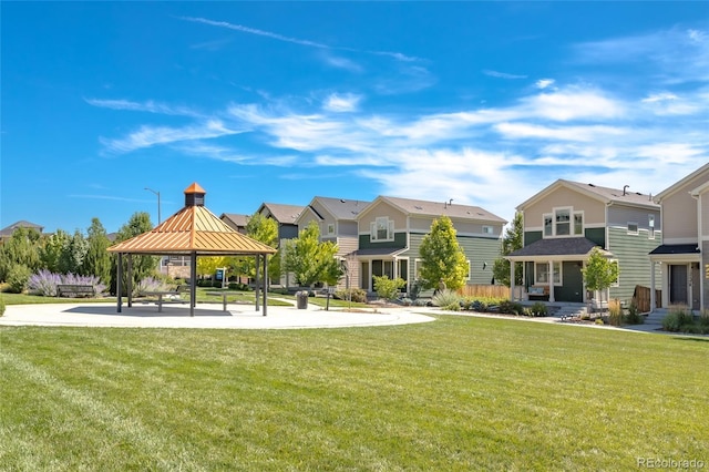 12743 Ulster St, Thornton, CO 80602 - view of community featuring a gazebo, a residential view, and a lawn