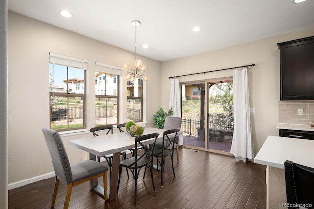 2559 S Kendrick St, Lakewood, CO 80228 - dining area with baseboards, recessed lighting, a chandelier, and dark wood-style floors