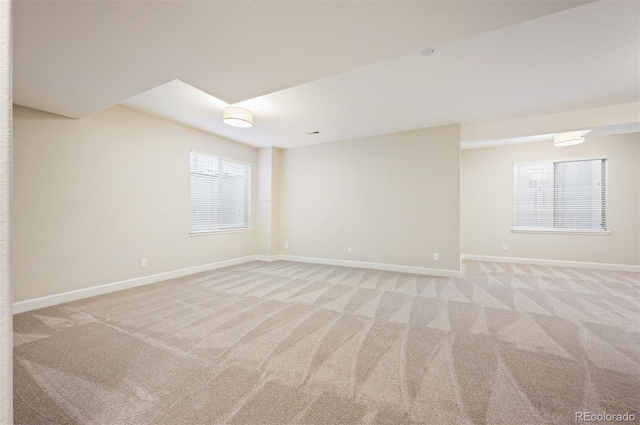 2559 S Kendrick St, Lakewood, CO 80228 - unfurnished room featuring a healthy amount of sunlight, baseboards, and light carpet