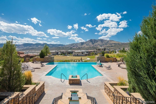 2559 S Kendrick St, Lakewood, CO 80228 - community pool with a mountain view and a patio area