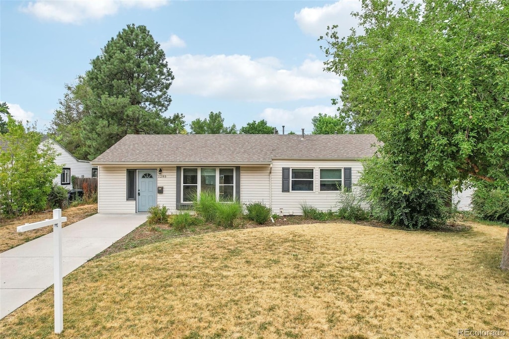 ranch-style house with a front lawn