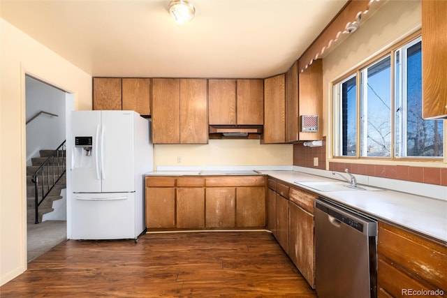 kitchen with black electric stovetop, dark hardwood / wood-style flooring, white fridge with ice dispenser, stainless steel dishwasher, and sink