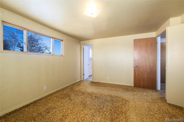 empty room featuring carpet flooring