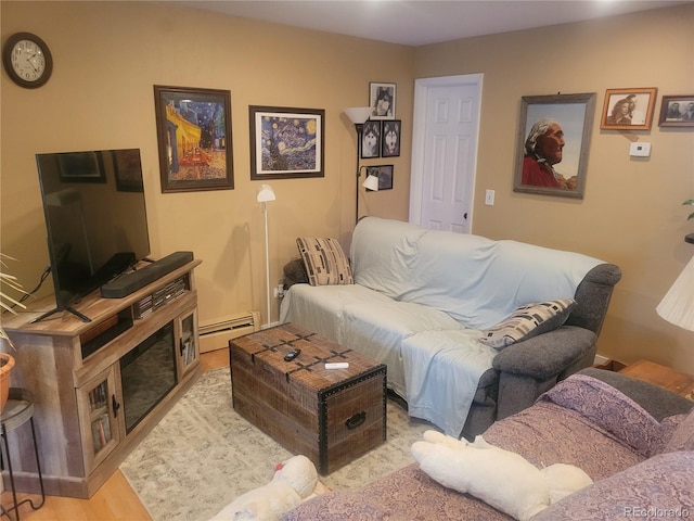 2190 S Holly St Unit 213, Denver, CO 80222 - living room featuring a baseboard radiator and wood finished floors