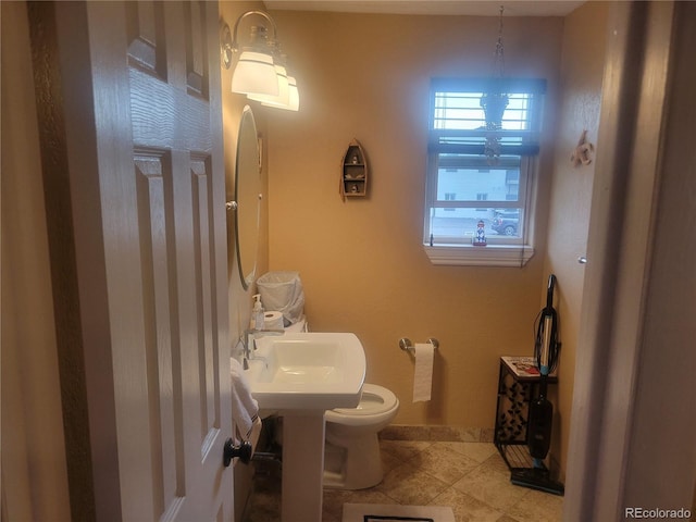 2190 S Holly St Unit 213, Denver, CO 80222 - half bathroom featuring tile patterned flooring and baseboards