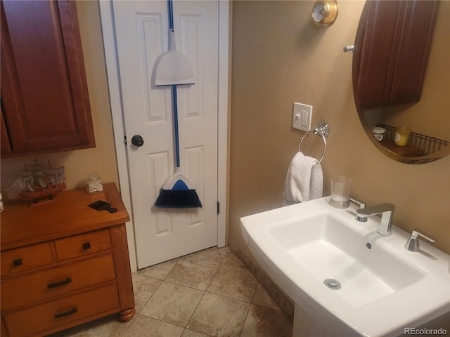 2190 S Holly St Unit 213, Denver, CO 80222 - bathroom with a sink and tile patterned floors