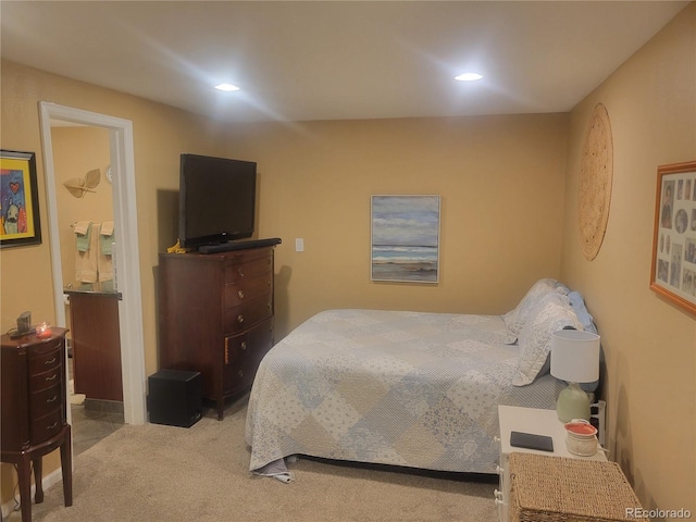 2190 S Holly St Unit 213, Denver, CO 80222 - carpeted bedroom with recessed lighting and ensuite bath