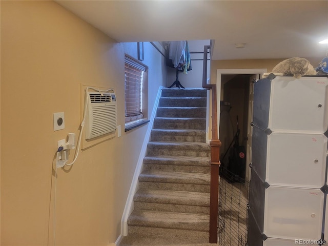 2190 S Holly St Unit 213, Denver, CO 80222 - staircase featuring baseboards and a wall mounted AC