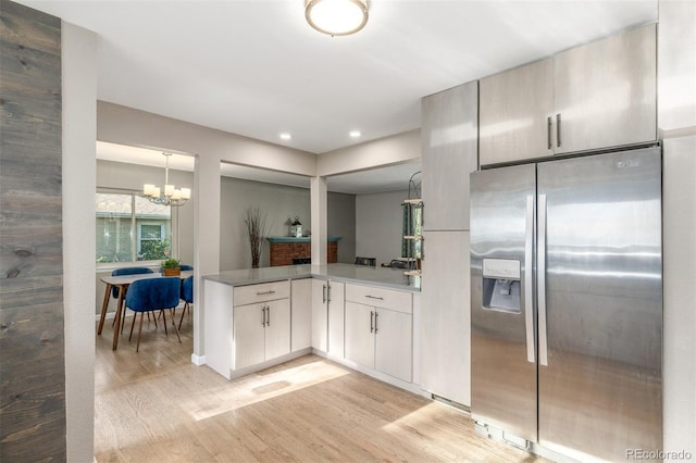6273 S Prescott St, Littleton, CO 80120 - kitchen featuring stainless steel refrigerator with ice dispenser, light wood-type flooring, a chandelier, recessed lighting, and a peninsula