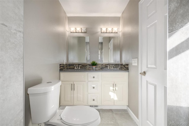 6273 S Prescott St, Littleton, CO 80120 - bathroom with vanity, tasteful backsplash, and tile patterned flooring