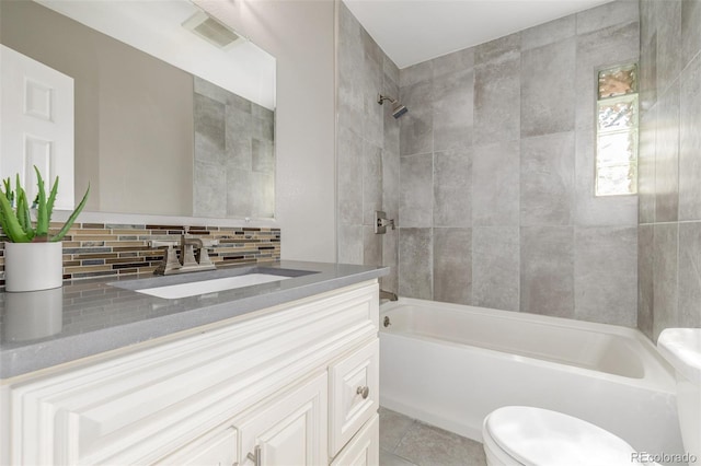 6273 S Prescott St, Littleton, CO 80120 - full bathroom with vanity, shower / bathtub combination, backsplash, and tile patterned floors