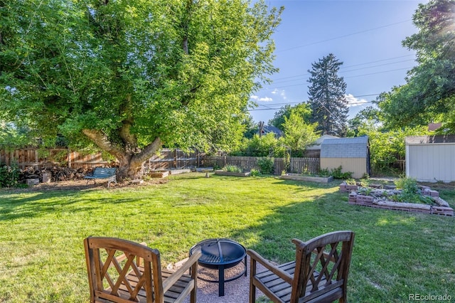 6273 S Prescott St, Littleton, CO 80120 - fenced backyard with an outdoor fire pit and a storage shed