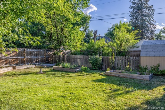 6273 S Prescott St, Littleton, CO 80120 - view of yard with a vegetable garden and a storage unit