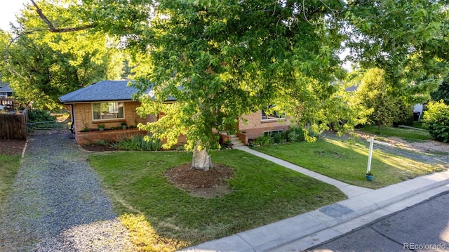 6273 S Prescott St, Littleton, CO 80120 - view of property hidden behind natural elements featuring brick siding
