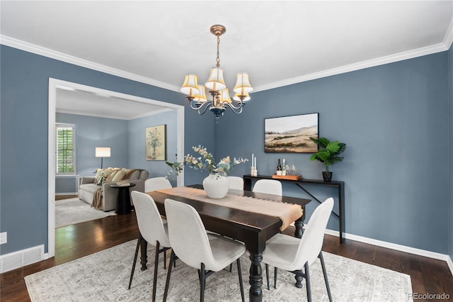 3966 S Magnolia Way, Denver, CO 80237 - dining area with a chandelier, baseboards, wood finished floors, and ornamental molding