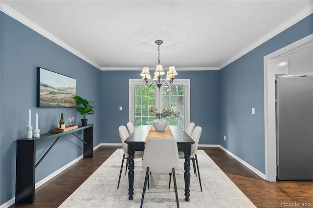 3966 S Magnolia Way, Denver, CO 80237 - dining room featuring a chandelier, dark wood-type flooring, ornamental molding, and baseboards
