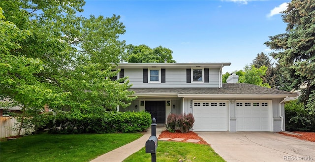 3966 S Magnolia Way, Denver, CO 80237 - traditional-style house featuring driveway and a garage