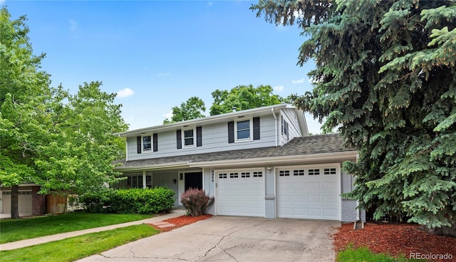 3966 S Magnolia Way, Denver, CO 80237 - traditional-style house with driveway, brick siding, a front lawn, and a garage
