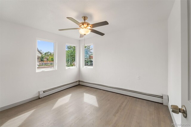 spare room featuring ceiling fan and light wood-type flooring