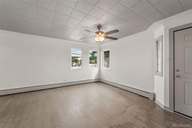 empty room featuring ceiling fan and wood-type flooring