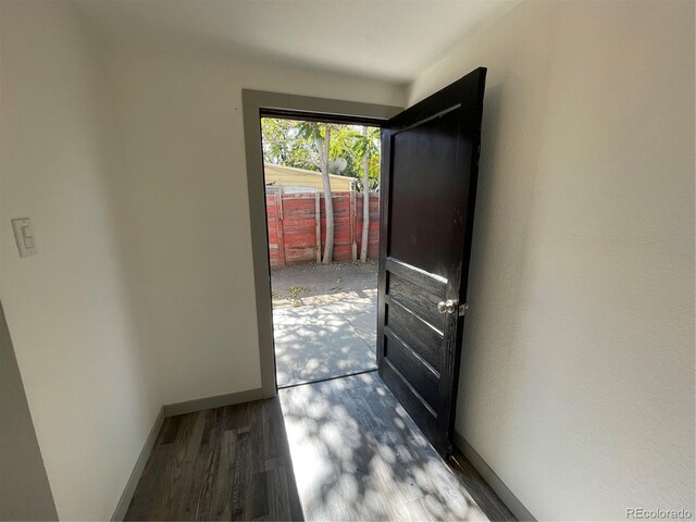 entryway with hardwood / wood-style flooring